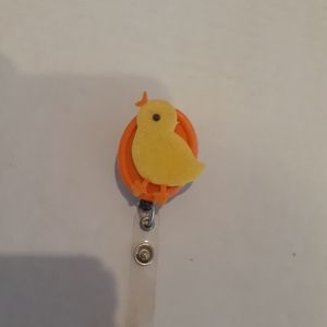Retractable name badge holder